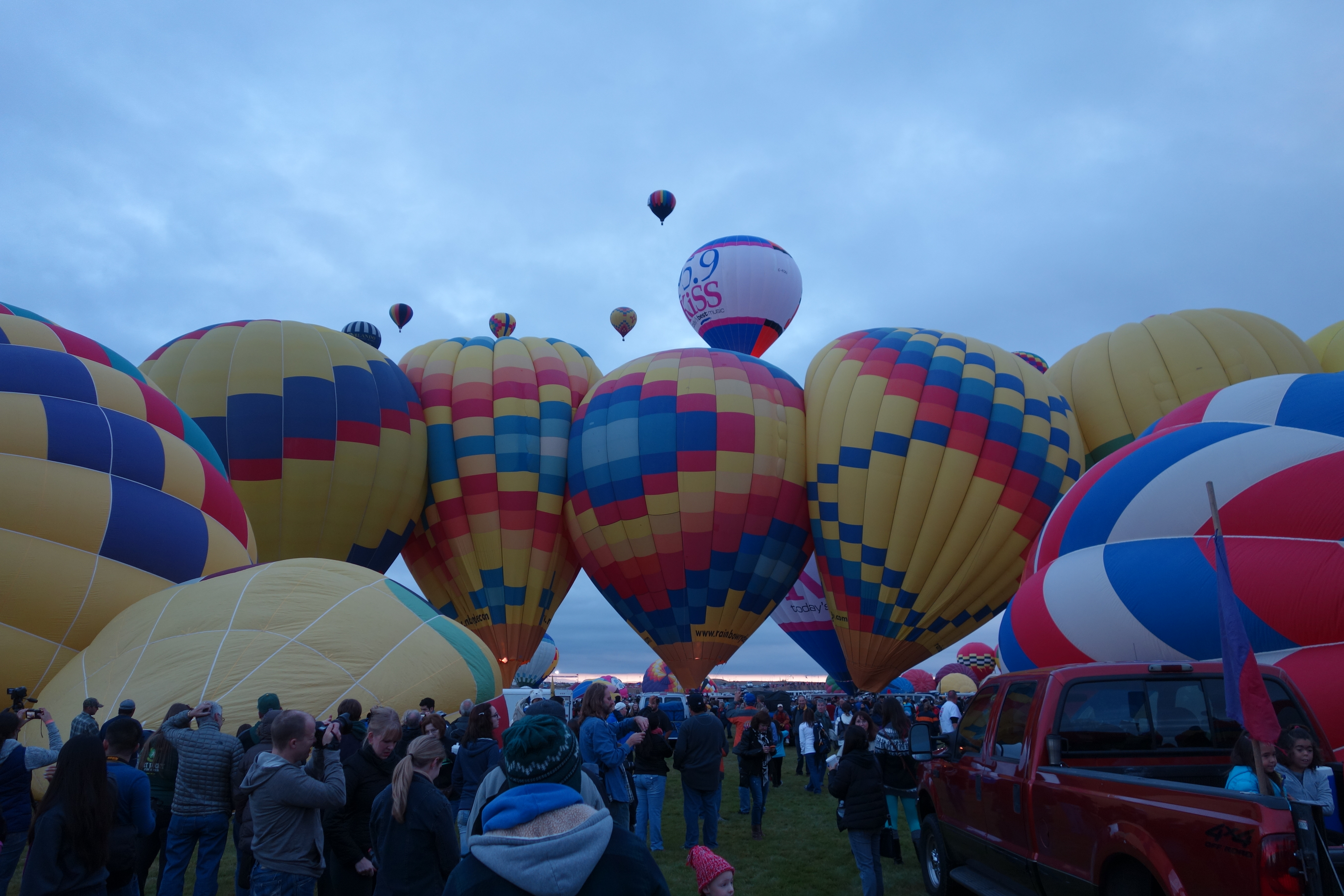 Row of hot air balloons very close together