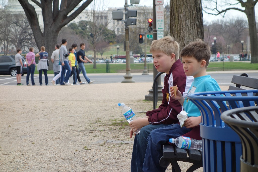 kids sitting on a bench on the Mall