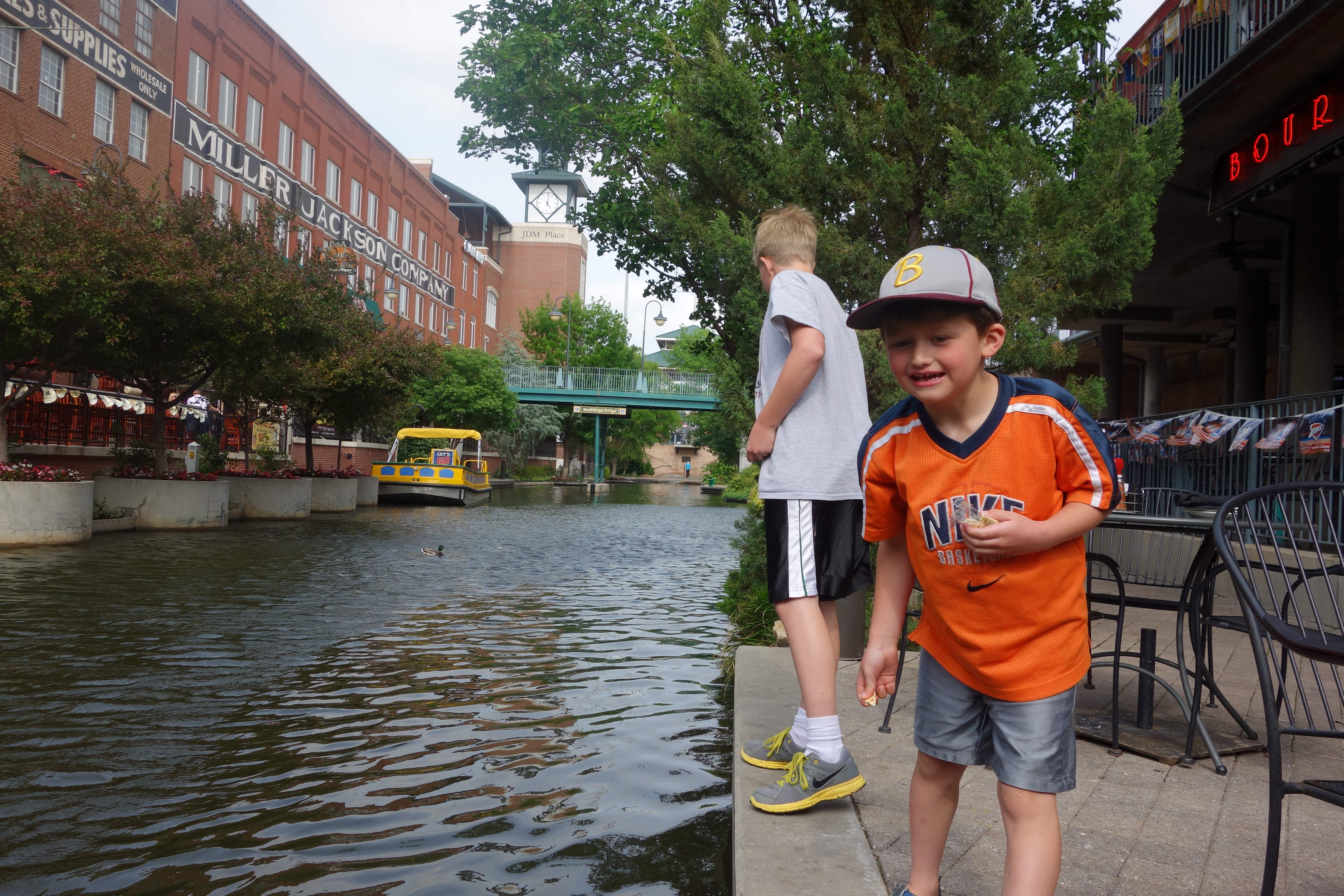 Feeding ducklings on the river walk.