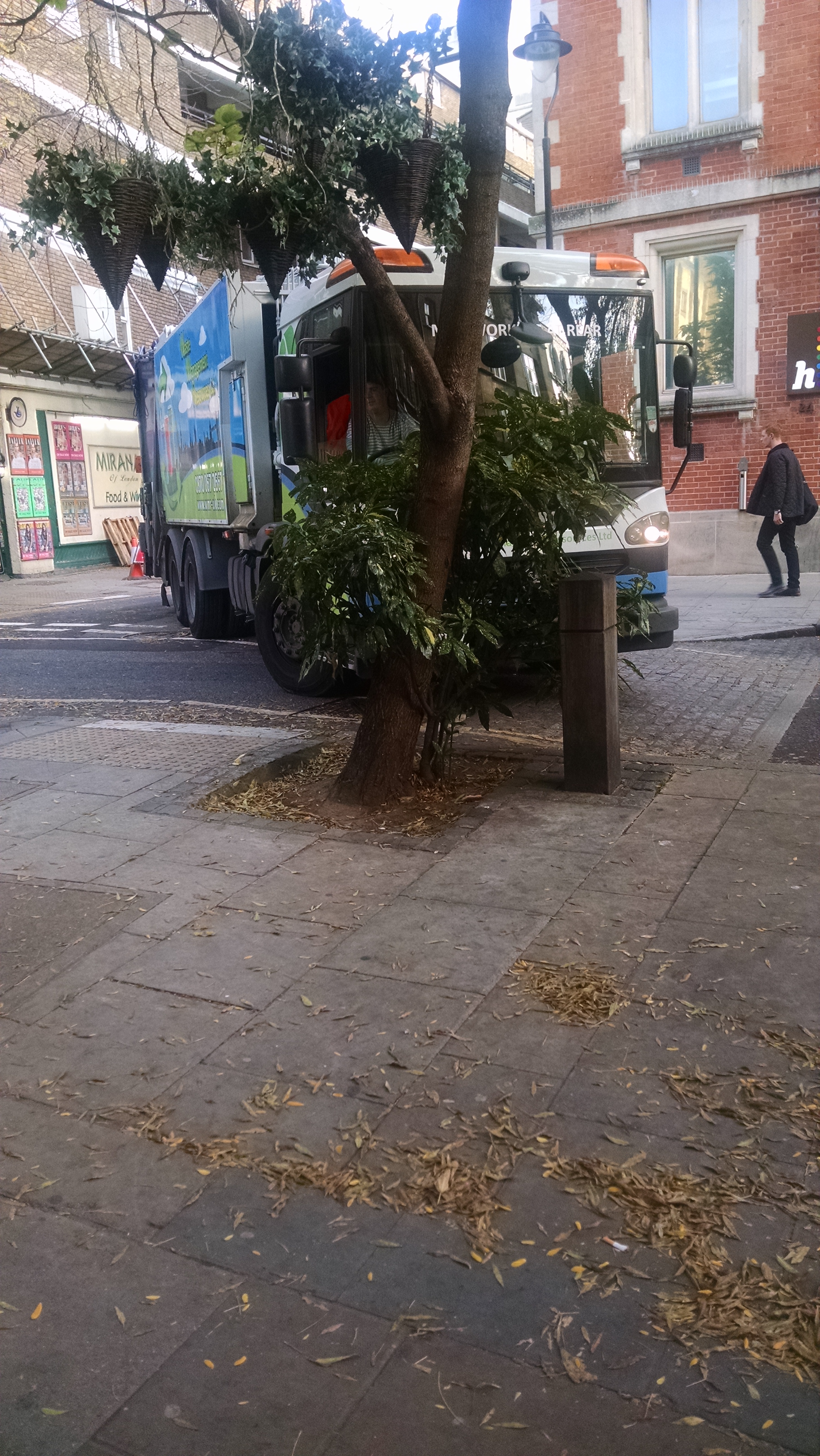 garbage truck in London stuck turning a corner
